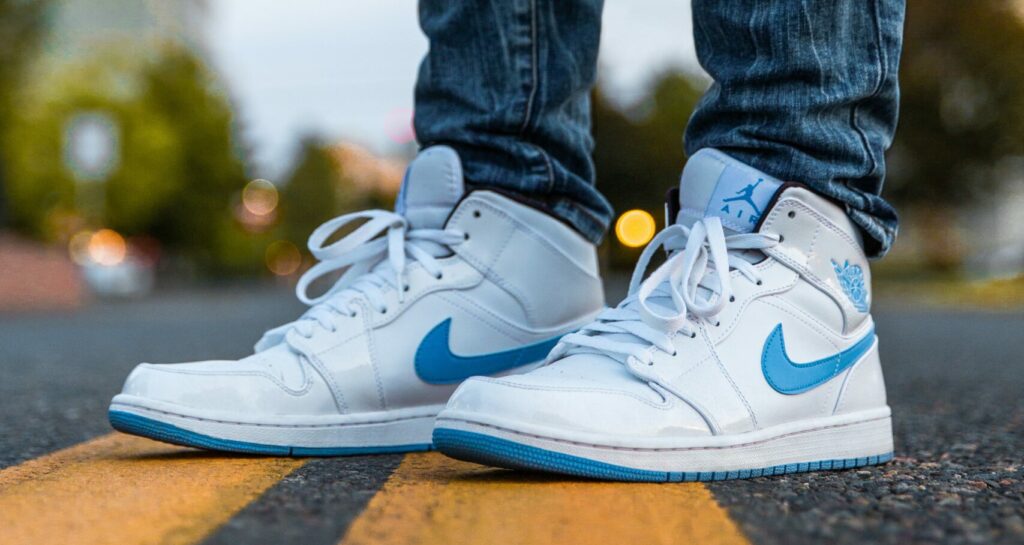 A pair of white and blue sneakers.